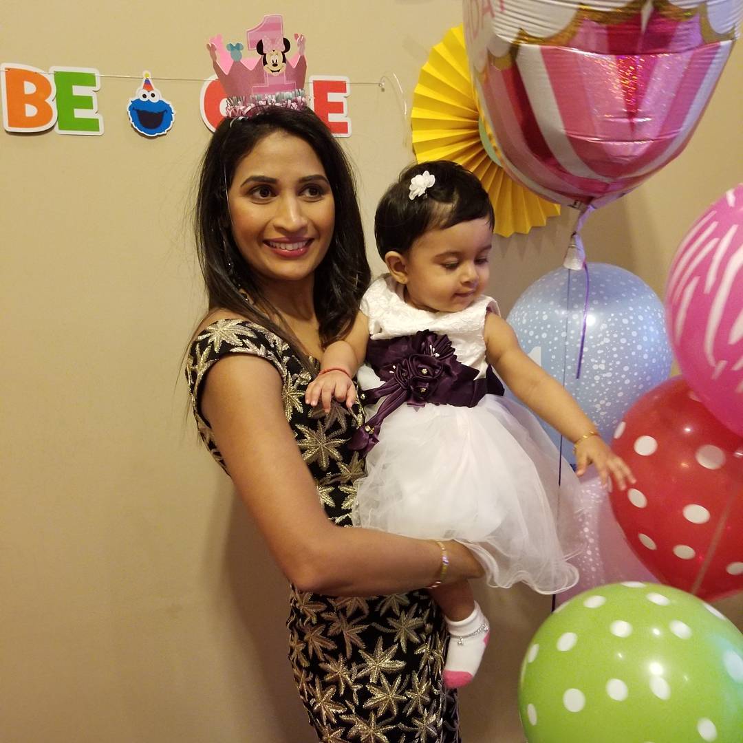 Birthday party makeup with luminous skin, defined brows and a berry lip with a festive crown