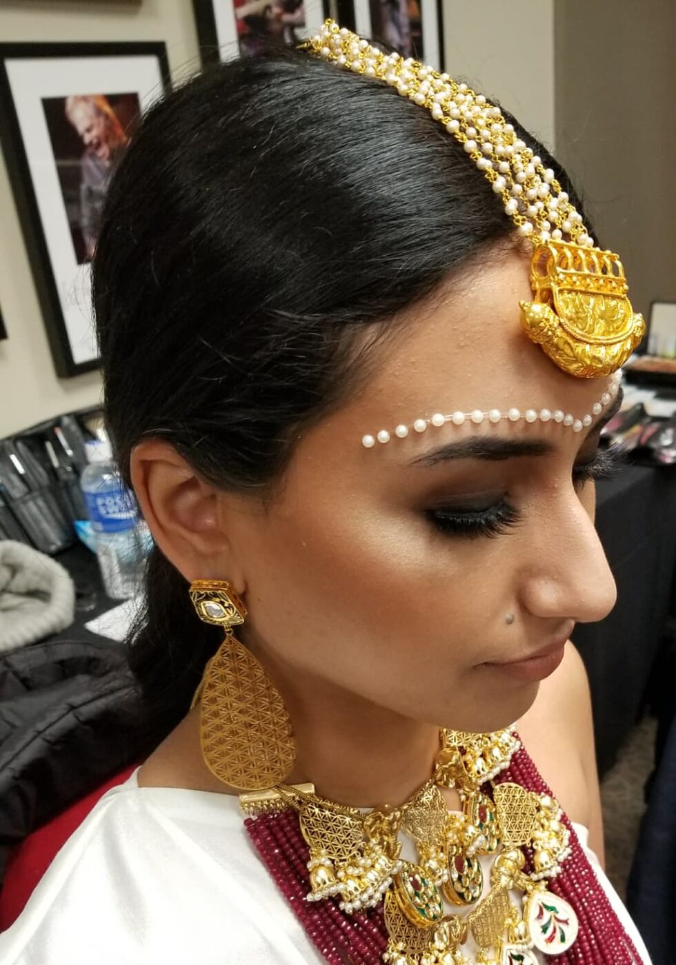 Editorial traditional look with deep smoky eyes, pearl headpiece and statement gold jewellery