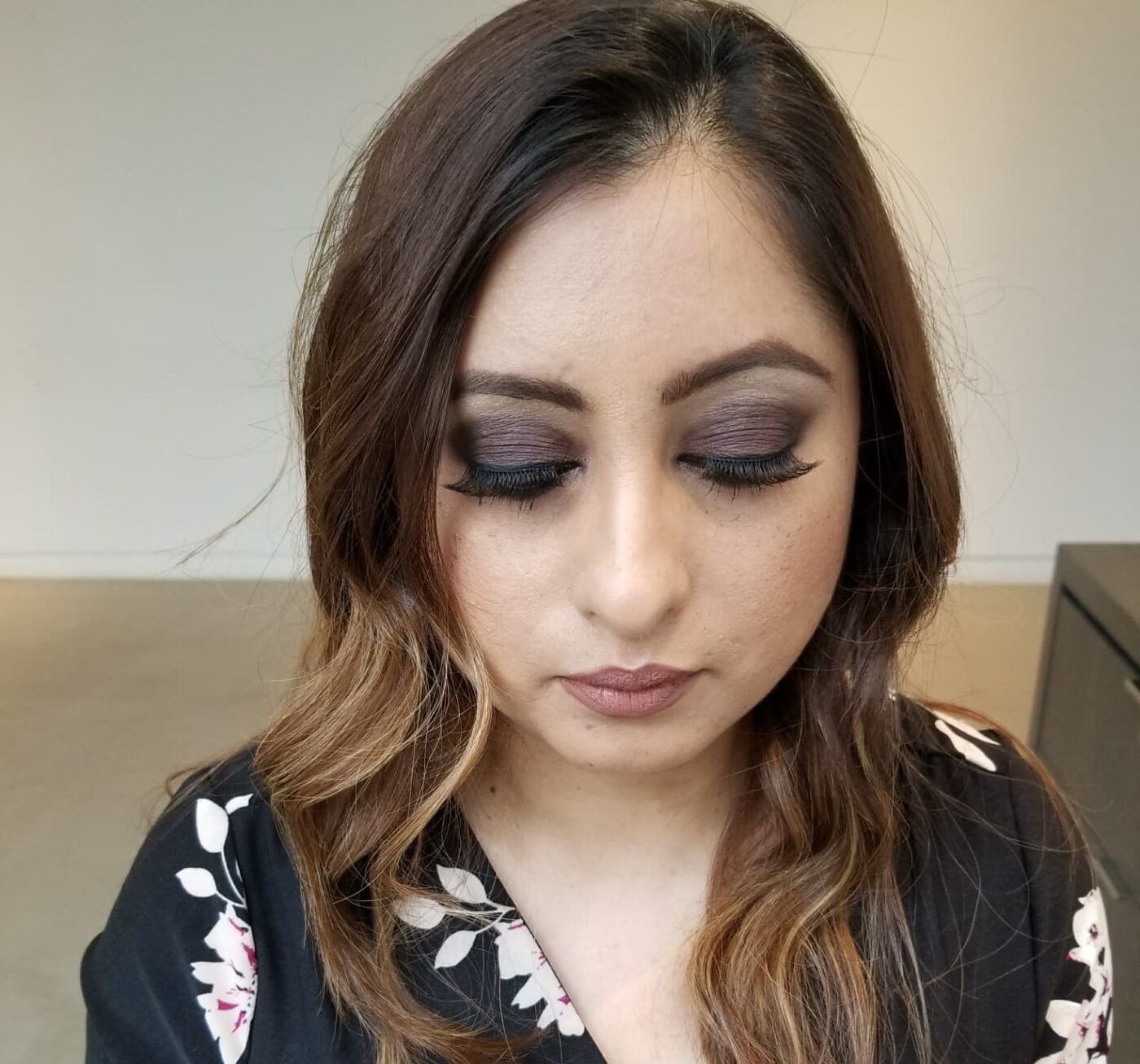 Soft glam with plum smoky eye, fluttery lashes and a mauve lip