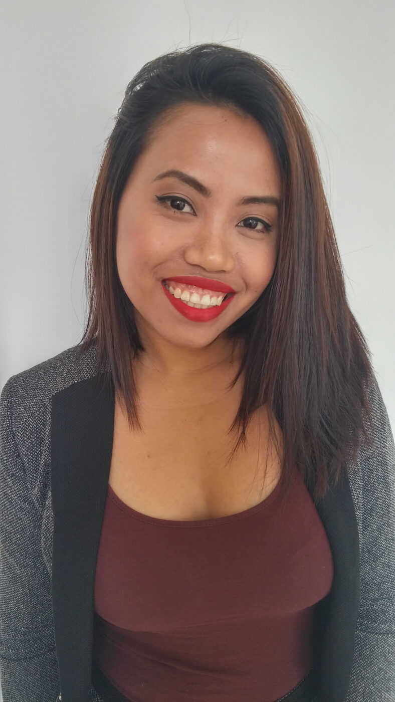 Camera-ready headshot makeup with clean liner, warm blush and a bright red lip